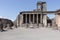 Ancient square forum with columns in Pompeii, Italy. Antique culture concept. Antique roman sculpture and architecture.