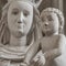 Ancient statue of Maria and Chris as baby at her hands, Magdeburg, Germany, details, closeup