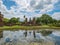 Ancient Statue reflection in the water in Wat mahathat Temple Area At sukhothai historical park