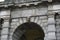 Ancient stone arch with carved stone bust in Dublin Ireland