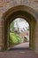Ancient stone archway in dunster castle