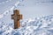 Ancient Stone Christian Cross in the Snow - Altopiano della Lessinia Veneto Italy
