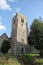 Ancient stone church tower and clock