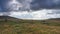 Ancient stone circle under Tors and dark sky, Dartmoor National Park, Devon