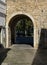 Ancient stone entry arch through city walls of Faro, Algarve, Portugal