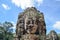 Ancient stone faces of Bayon temple, Angkor, Siem Reap, Cambodia. September 1, 2015