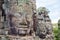 Ancient stone faces of Bayon temple, Angkor, Siem Reap, Cambodia. September 1, 2015