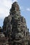 Ancient stone faces Bayon temple in Angkor Thom