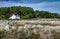 Ancient Stone Field Alignements De Menhir Carnac With Neolithic Megaliths And Old Cottage In Brittany, France