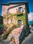 Ancient stone house decorated with ivy, historic center of the town of Castel San Vincenzo, Molise