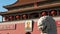 Ancient stone lion close up and mao zedong portrait in tiananmen square