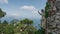 Ancient stone mane sculpture on Monte Solare gaze over Sorrento Peninsula