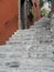 Ancient Stone Rustic Grey Staircase and Old Stucco Textured Doorway Wall Symbolizing Climbing, Challenge, Rising Above, Progress