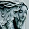 Ancient stone statue of Jesus Christ and Virgin Mary. Faith, religion, death, resurrection concept. Selective focus