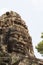 Ancient stone tower of Banteay Kdei temple, Angkor Wat. Ancient temple tower with Buddha face.