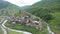 Ancient stone towers and Ushguli village at the foot of Mt. Shkhara. Picturesque and gorgeous scene. Rock tower towers and old hou