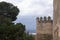 The ancient stone walls of the Arab fortress Gibralfaro. Landmark of Malaga, Spain.