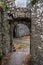 Ancient stone walls with arched passage in Rozafa Castle in Shkoder, Albania