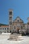 Ancient stone well and cathedral in Hvar, Croatia