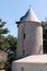Ancient stone windmill typical in island of Noirmoutier Vendee France