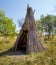 Ancient storage pit for storing food with a built-in straw hut