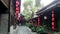 A ancient street with red chinese lanterns after mild rain