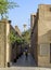 Ancient streets of Bastakiya, Dubai, with a mosque minaret at the end of the street.