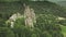 Ancient stronghold at mountain forest aerial. Tourist landmark. Nature landscape. History heritage
