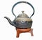 Ancient teapot on wood support.