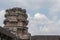 Ancient temple Angkor Wat tower and sky view. Massive stone temple Angkor Wat on sky background.