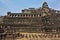 An ancient temple in the form of a stepped pyramid against the blue sky