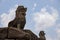 Ancient temple stone monument of Roluos temples, Cambodia. Barong lion statue on top of Bacong temple.