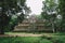 Ancient temples of Angkor, Siem Reap, Cambodia covered by a lot of vegetation and surrounded by a beautiful green forest - World