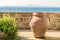 Ancient Terracotta Vase against a Mediterranean Panorama