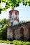 Ancient tower with a brick and stone wall ruins of a gothic Lutheran Church