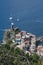 Ancient tower dominates the sea with boats. Vernazza, Cinque Terre, La Spezia, Italy