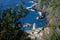 Ancient tower dominates the sea with boats. Vernazza, Cinque Terre, La Spezia, Italy