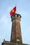 Ancient tower of the fortress with the Vietnamese flag. Hanoi