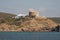 Ancient tower on rocky shore. Cala Mesquida, Menorca, Spain