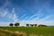 Ancient trulli, countryside, sea and clouds in Puglia