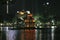 The ancient Turtle Tower in the middle of the Hoan Kiem lake in the city of Hanoi illuminated at night