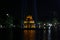 The ancient Turtle Tower in the middle of the Hoan Kiem lake in the city of Hanoi illuminated at night