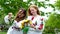 ancient Ukrainian traditions weaving wreaths on Ivan Kupala two girls with beautiful red hair during wind are preparing