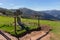 Ancient unknown cross on Camino de Santiago in Pyrenees mountains, France. Pilgrimage concept. Stone cross in the mountains.