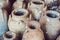 Ancient Vietnamese traditional pots overgrown with seashells