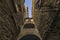 Ancient village with passage under archway in Tuscany