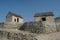 Ancient village street view with two small huts and crossroads