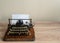 Ancient vintage portable typewriter with non qwerty keyboard