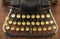 Ancient vintage portable typewriter with non qwerty keyboard