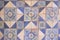 Ancient wall of patchwork pattern from colorful Moroccan, Portuguese tiles, Valencian, Tile, ornaments, Surface textures.